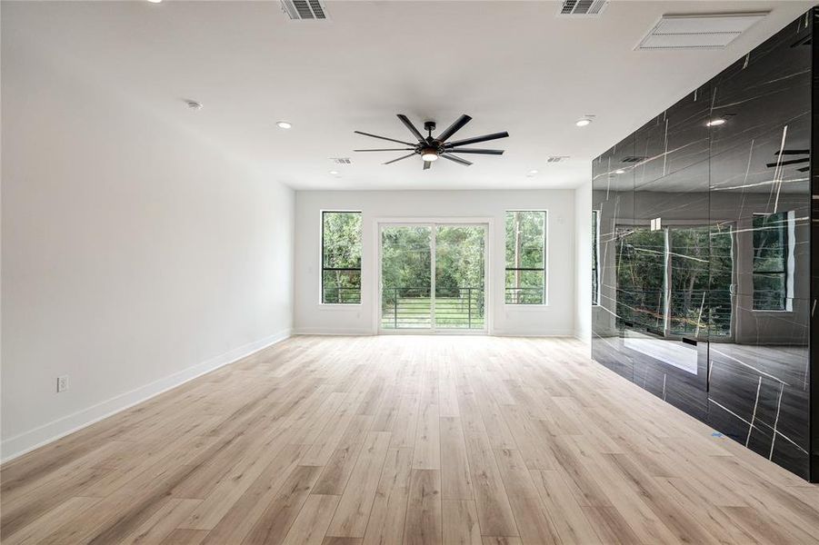 The living room has a nice balcony off of the front and fireplace for ambiance.