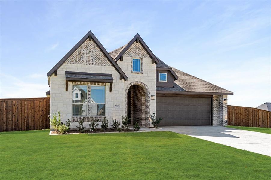 Front exterior of a new home in Wildcat Ridge Phase 2 and 4, Godley, TX, highlighting curb appeal (Image 2).