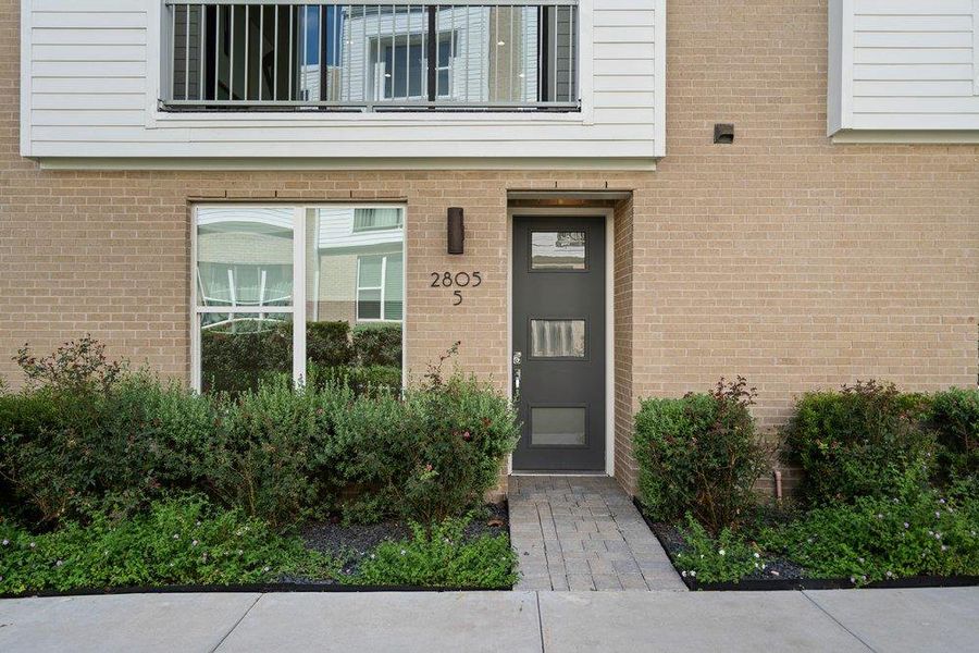 A modern brick exterior welcomes visitors with clean architectural lines and professional landscaping. A modern brick exterior welcomes visitors with clean architectural lines and professional landscaping.