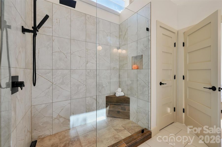 primary shower with large linen closet
