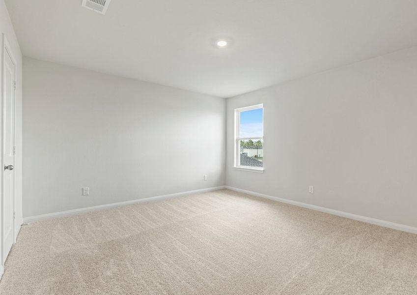 Spacious upstairs bedroom with lush carpet Spacious upstairs bedroom with lush carpet