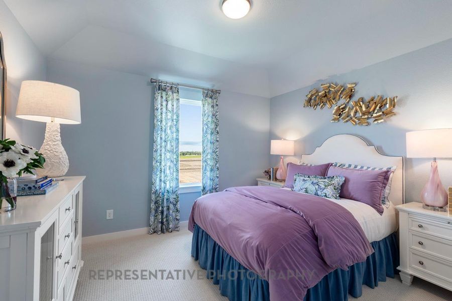 Bedroom with light carpet and baseboards