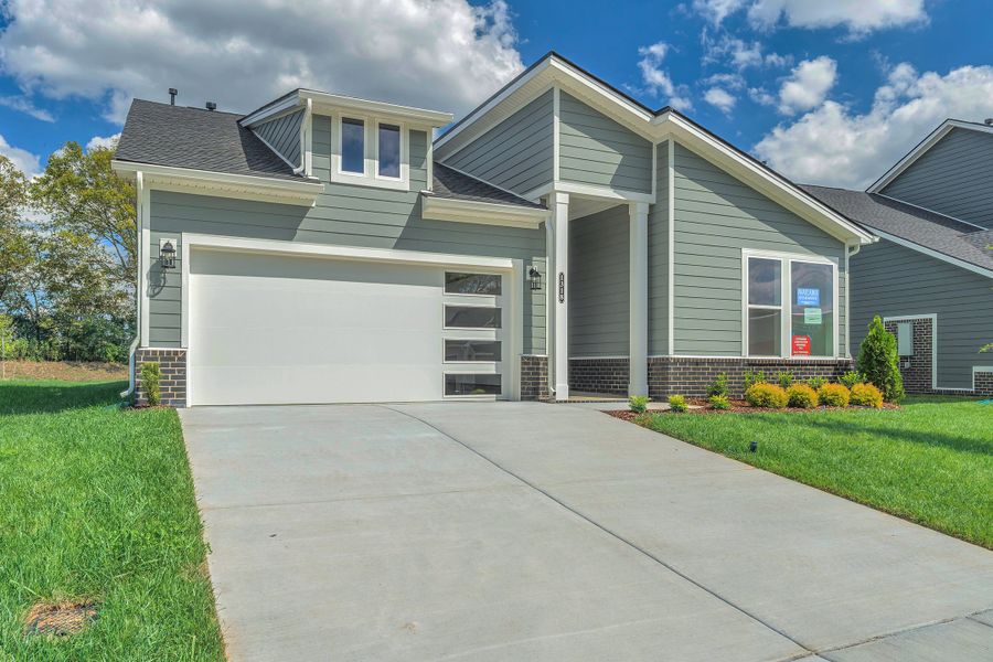 Exterior details and patio area of a home in Nexus – Village Collection, Gallatin (Image 16).