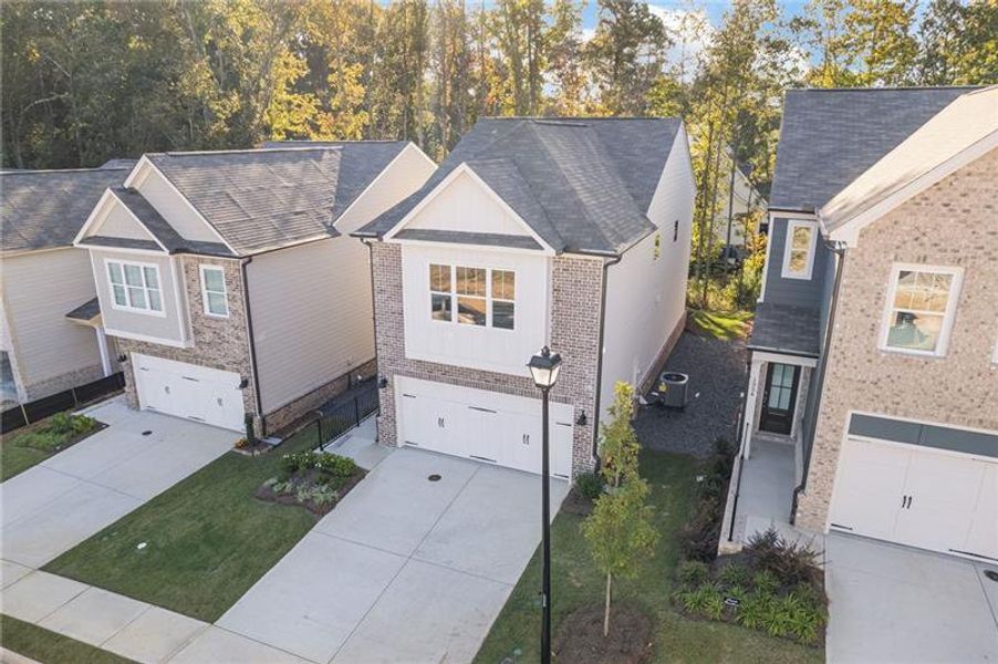 Front exterior of a new home in , Dacula, GA, highlighting curb appeal (Image 15).