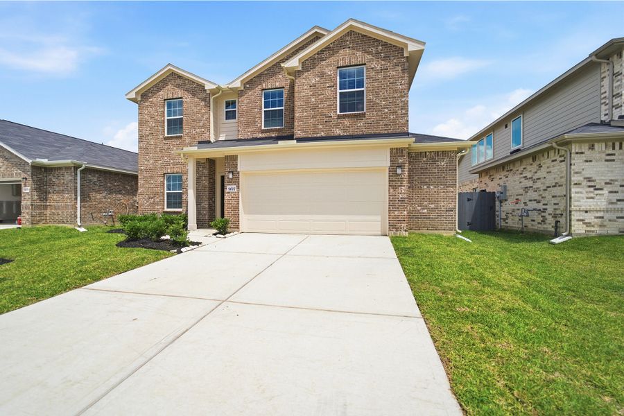 Front exterior of a new home in Bay Creek, Baytown, TX, highlighting curb appeal (Image 2).