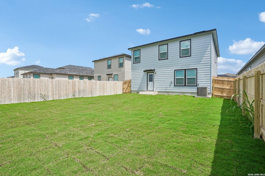 Exterior details and patio area of a home in Medina Crossing, Von Ormy (Image 19).