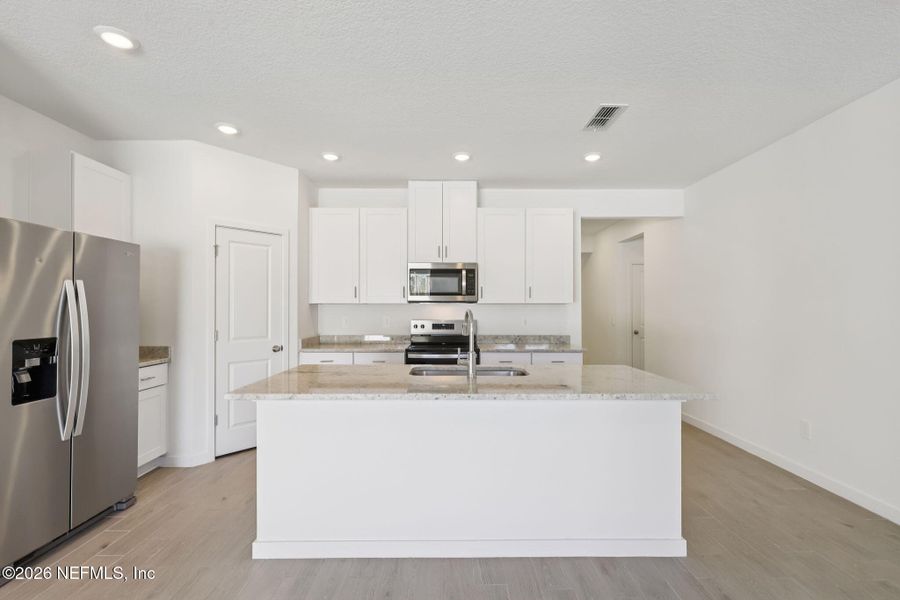 Furnished interior view inside a new home in Flagler Village - Signature Series, Palm Coast (Image 9).