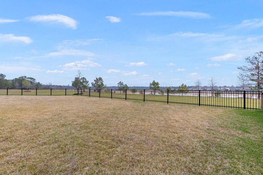 Spacious yard with full sprinkler system.