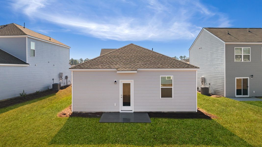 Exterior details and patio area of a home in Pine Hills at Cane Bay, Summerville (Image 3).