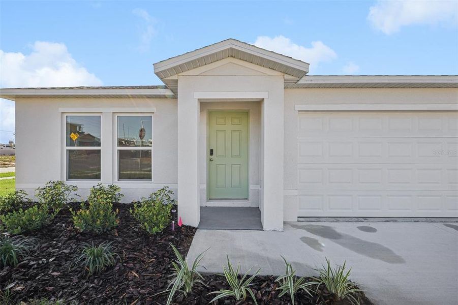 Exterior details and patio area of a home in The Enclave at Scenic Terrace, Haines City (Image 3).