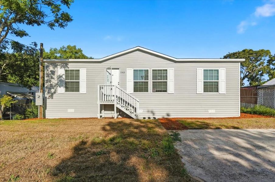 Exterior details and patio area of a home in , Port Richey (Image 18).
