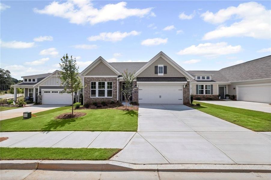 Front exterior of a new home in Laurel Farms, Dallas, GA, highlighting curb appeal (Image 19). Front exterior of a new home in Laurel Farms, Dallas, GA, highlighting curb appeal (Image 19).