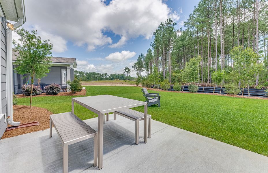 Nice the nice weather on a rocking chair or  bench