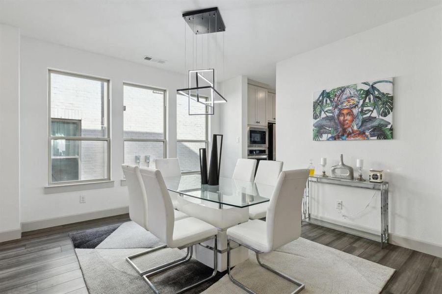 Dining area featuring dark wood-type flooring Dining area featuring dark wood-type flooring