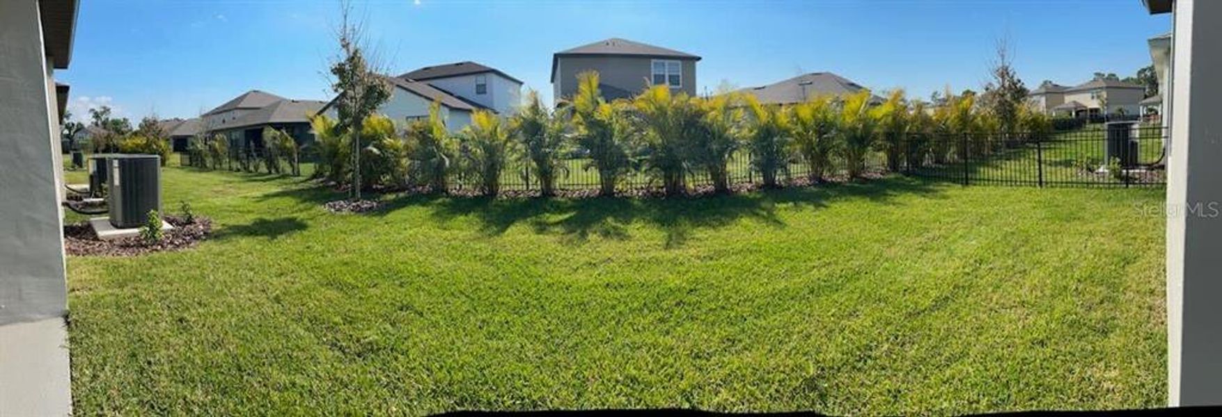 Exterior details and patio area of a home in Isles at Bayview, Parrish (Image 3).