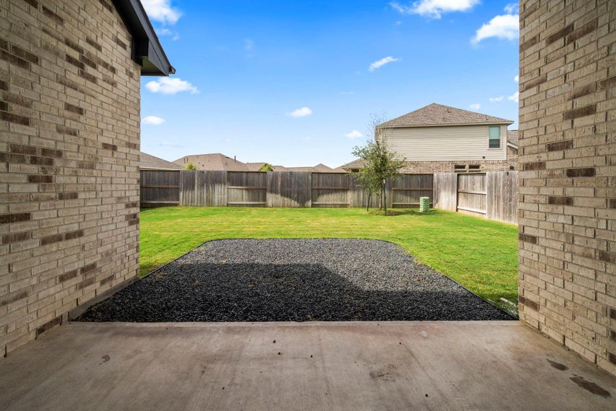 Exterior details and patio area of a home in Meridiana, Iowa Colony (Image 3).