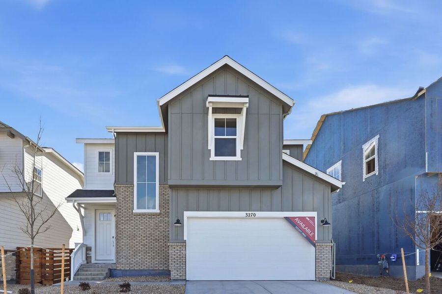 Front exterior of a new home in The Aurora Highlands, Aurora, CO, highlighting curb appeal (Image 1). Front exterior of a new home in The Aurora Highlands, Aurora, CO, highlighting curb appeal (Image 1).