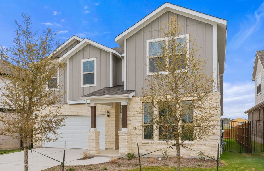 Front exterior of a new home in Saddleback at Santa Rita Ranch, Liberty Hill, TX, highlighting curb appeal (Image 22).