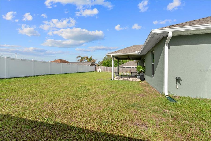 Exterior details and patio area of a home in Orange Blossom Hills, Summerfield (Image 24).