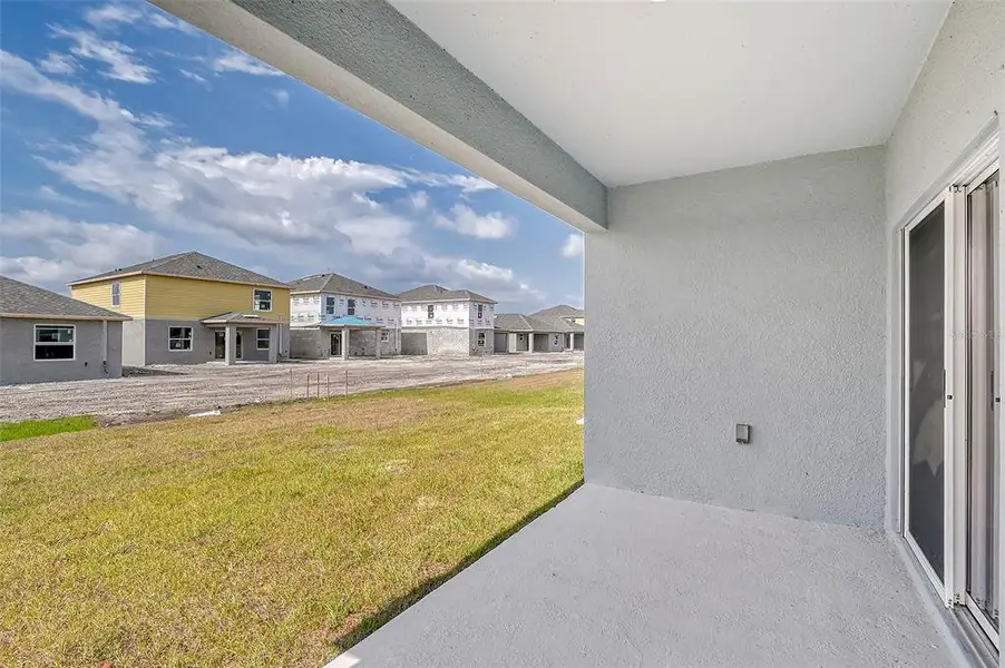 Exterior details and patio area of a home in Broadleaf, Parrish (Image 3).