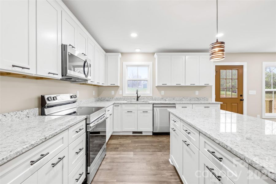 Furnished interior view inside a new home in , Statesville (Image 7).