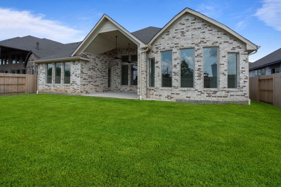 Front exterior of a new home in Coastal Point, League City, TX, highlighting curb appeal (Image 22).