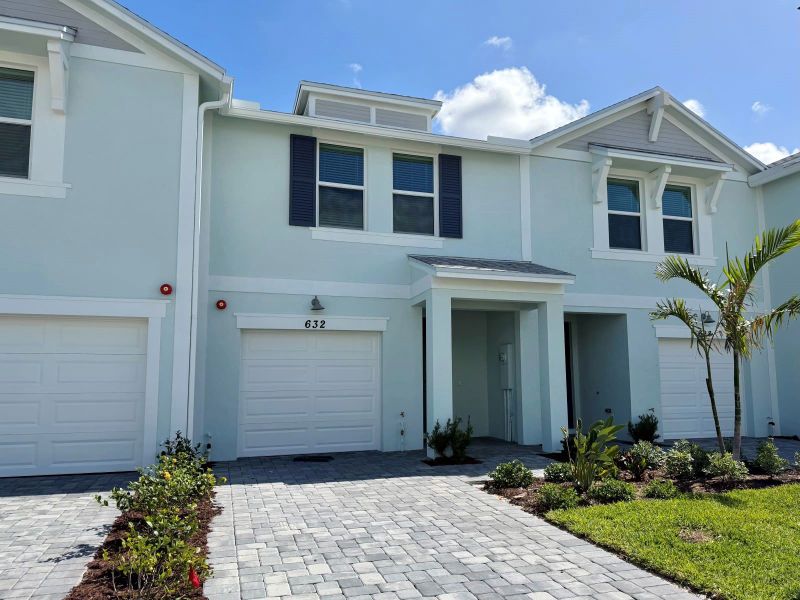 Front exterior of a new home in Tidewater, Fort Pierce, FL, highlighting curb appeal (Image 2). Front exterior of a new home in Tidewater, Fort Pierce, FL, highlighting curb appeal (Image 2).