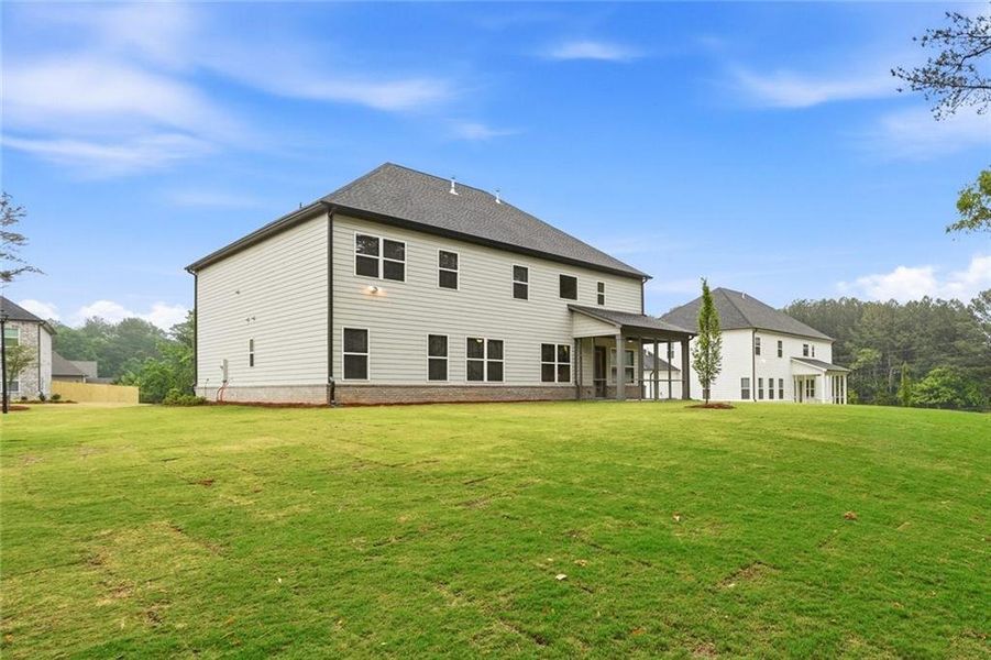 Exterior details and patio area of a home in The Stables at Ewing Chapel, Dacula (Image 3).