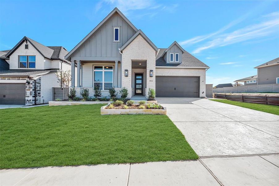 Front exterior of a new home in Treeline, Justin, TX, highlighting curb appeal (Image 1).