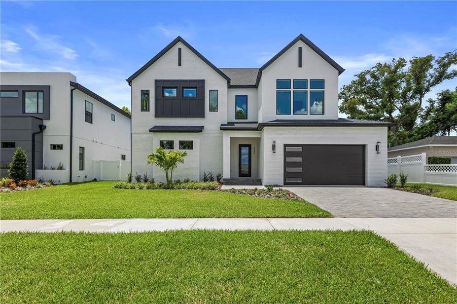 Front exterior of a new home in , Tampa, FL, highlighting curb appeal (Image 29).