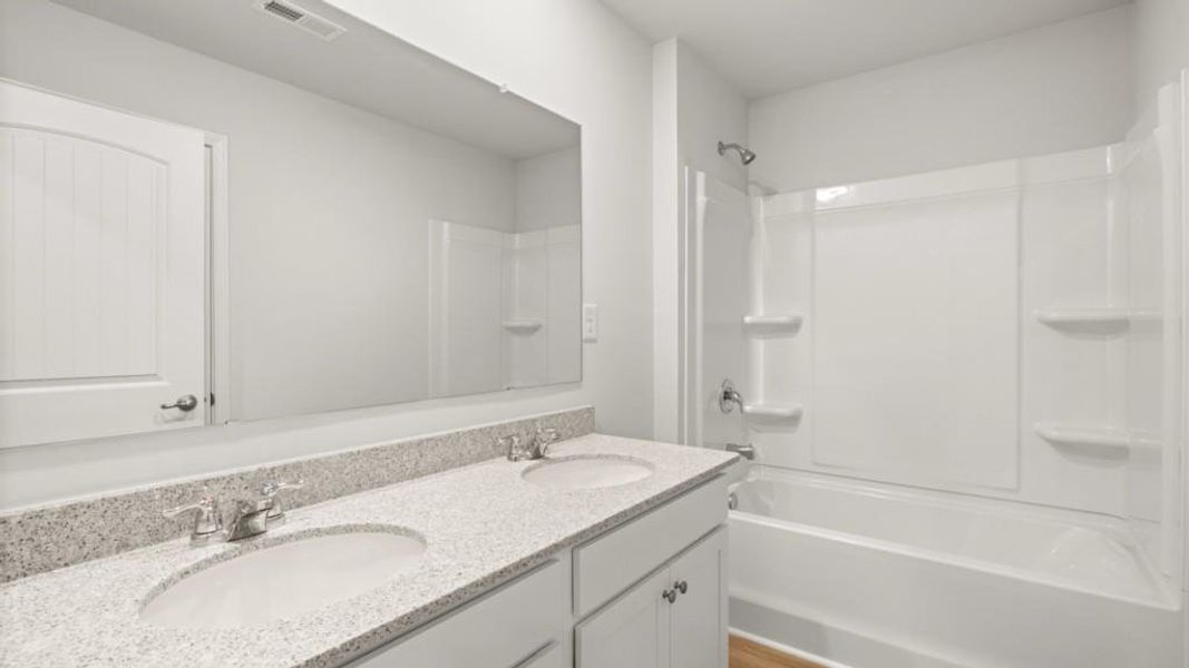 Furnished interior view inside a new home in Fairway 17 at Mirror Lake, Villa Rica (Image 7).