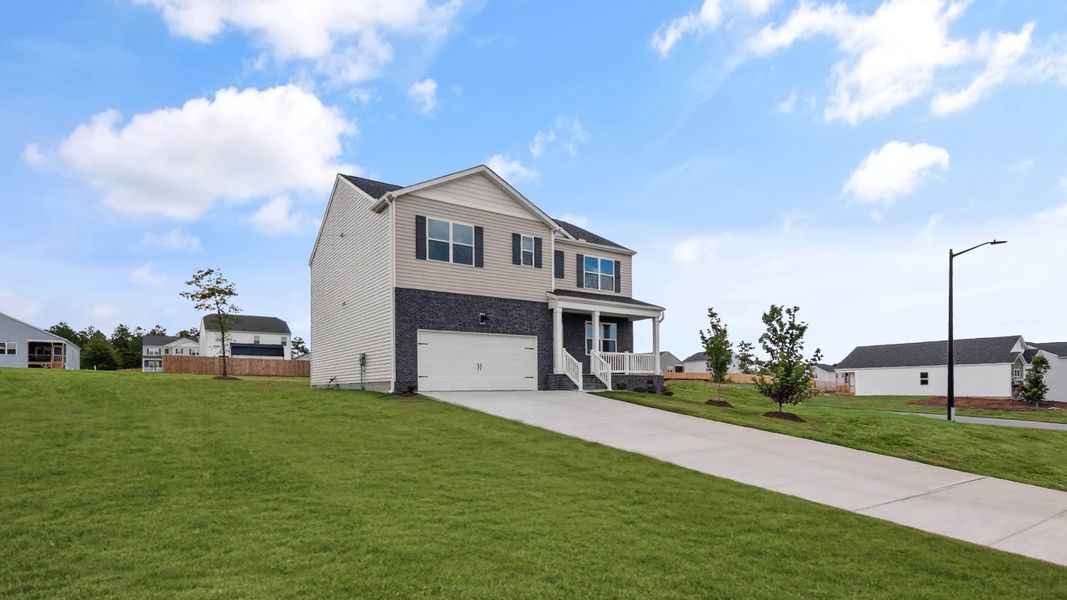 Front exterior of a new home in Mason Ridge, Spring Lake, NC, highlighting curb appeal (Image 18). Front exterior of a new home in Mason Ridge, Spring Lake, NC, highlighting curb appeal (Image 18).