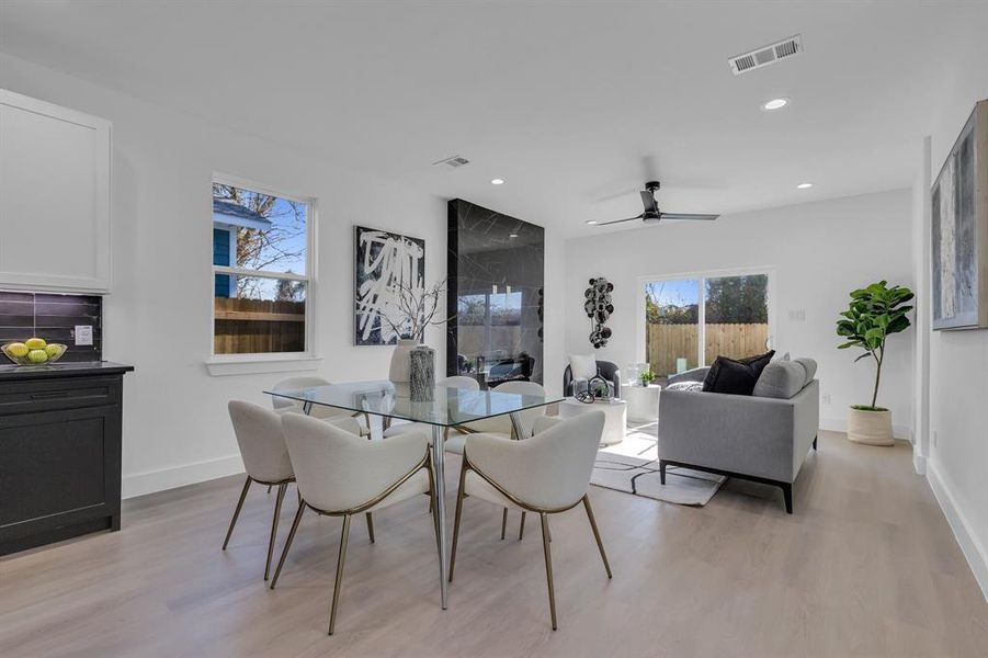 Dining room featuring light hardwood / wood-style flooring and ceiling fan