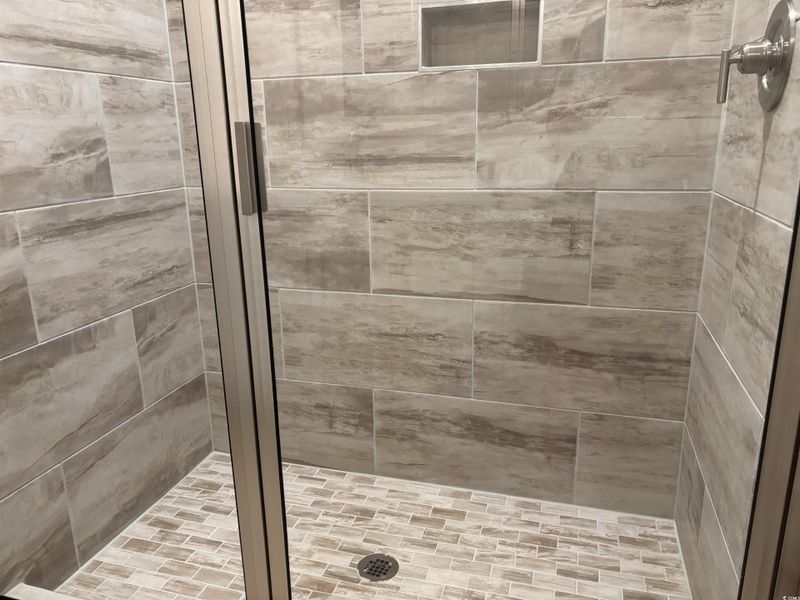 Full bath featuring a stall shower
