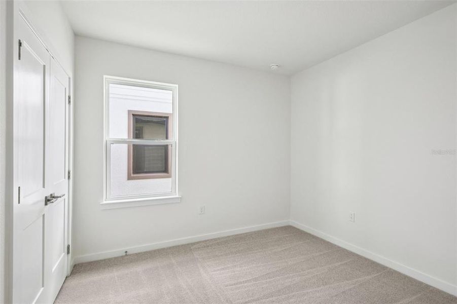 Spacious, unfurnished interior of a new home in Grasslands West, Lakeland (Image 24).
