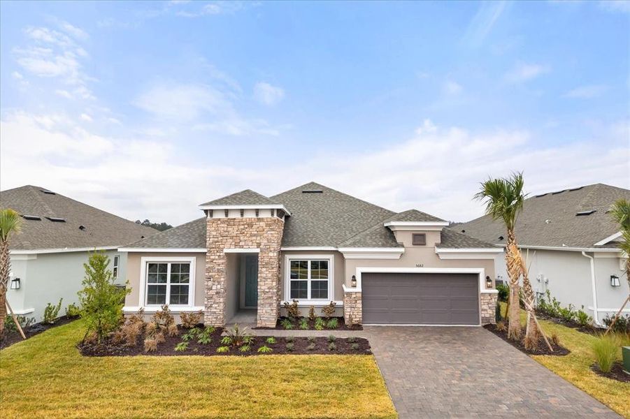 Front exterior of a new home in , Kissimmee, FL, highlighting curb appeal (Image 2). Front exterior of a new home in , Kissimmee, FL, highlighting curb appeal (Image 2).
