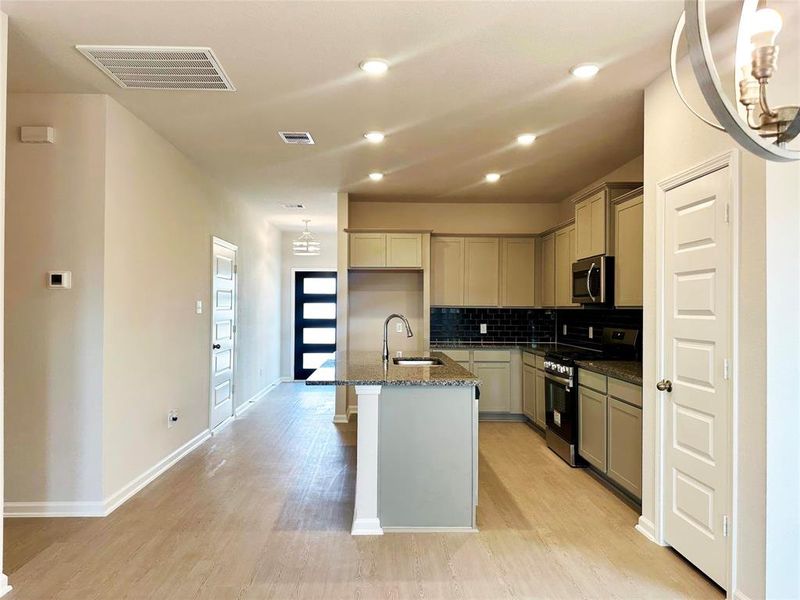 The Piedmont- Family Room into the Kitchen. The Piedmont- Family Room into the Kitchen.