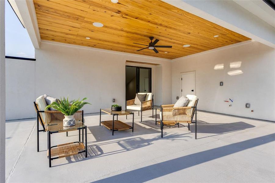 View of patio featuring ceiling fan and an outdoor hangout area