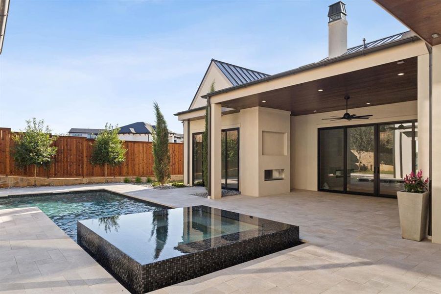 View of swimming pool with ceiling fan, a patio area, and a fenced backyard View of swimming pool with ceiling fan, a patio area, and a fenced backyard