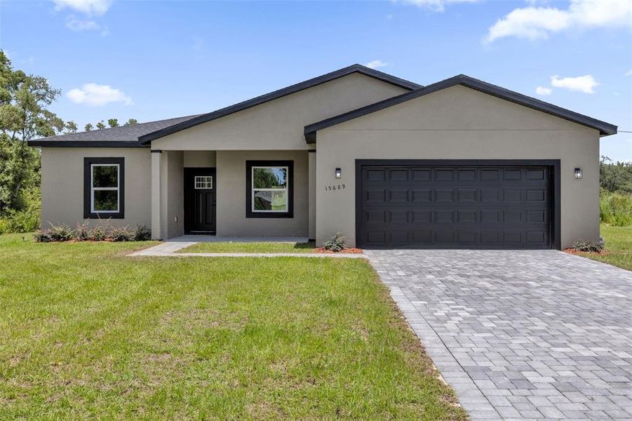 Front exterior of a new home in , Ocala, FL, highlighting curb appeal (Image 21).