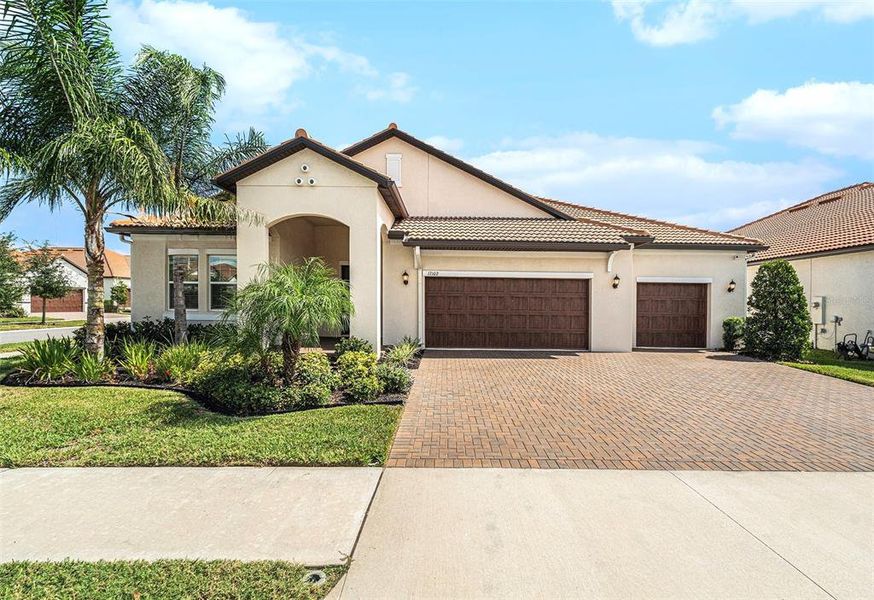Front exterior of a new home in , Wimauma, FL, highlighting curb appeal (Image 20).