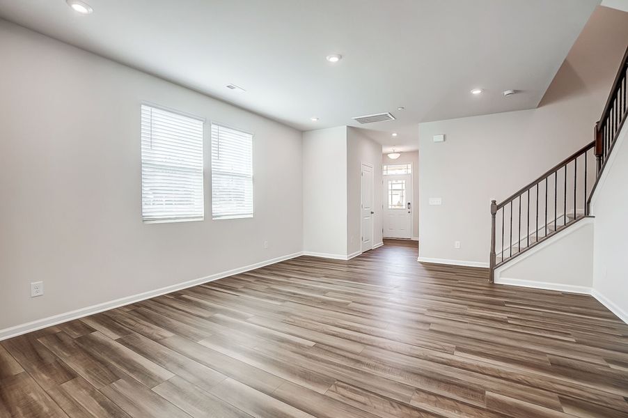 Gathering room with hall to foyer