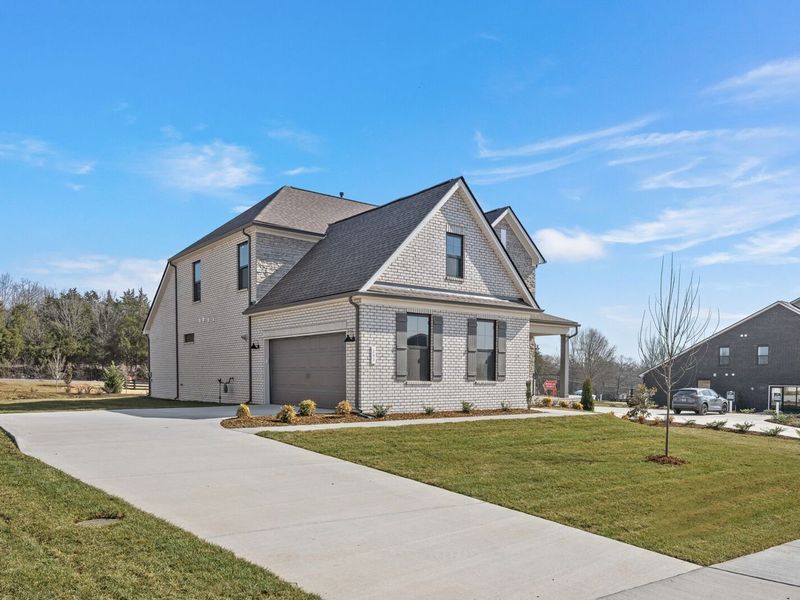 Front exterior of a new home in Benders Cove, Mount Juliet, TN, highlighting curb appeal (Image 21).
