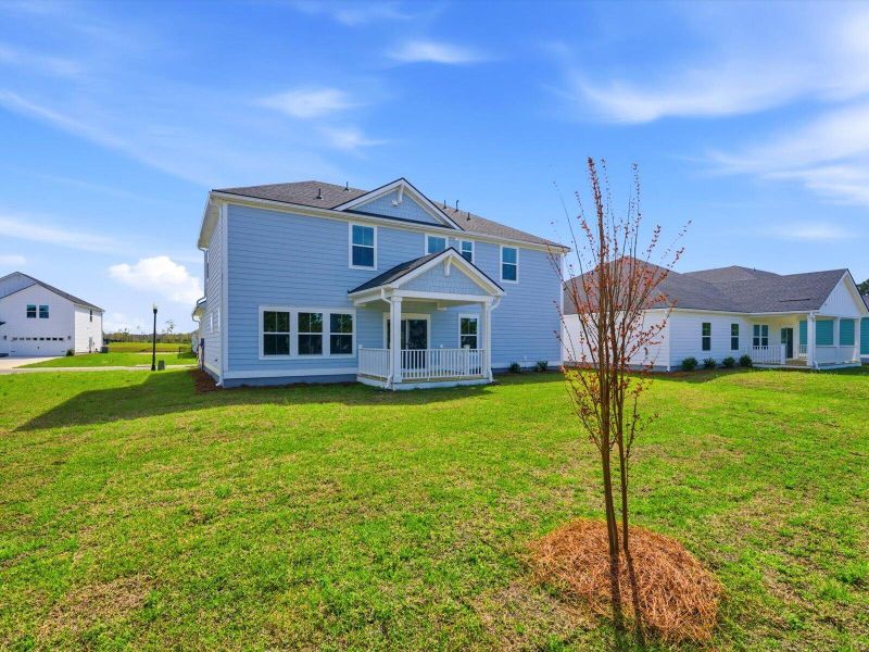 Exterior details and patio area of a home in The Coves at Lakes of Cane Bay II, Summerville (Image 3).