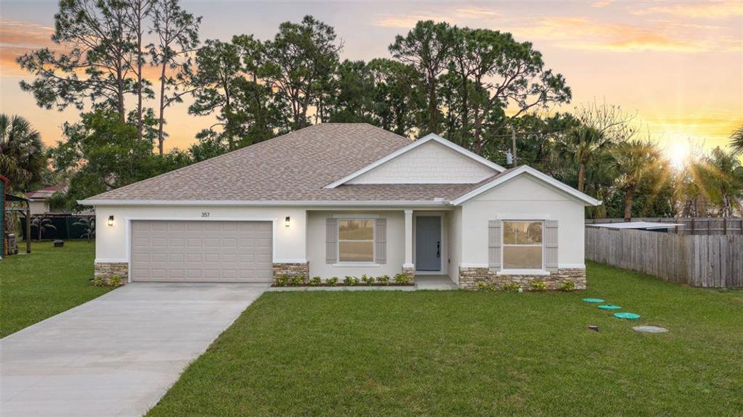Front exterior of a new home in , Palm Bay, FL, highlighting curb appeal (Image 30).