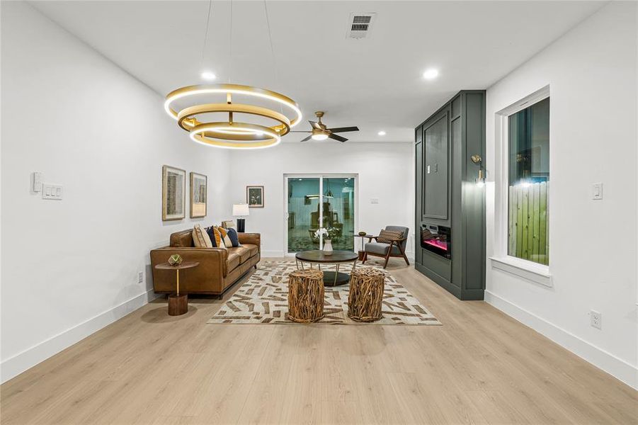 Living area featuring light wood-type flooring, recessed lighting, and ceiling fan