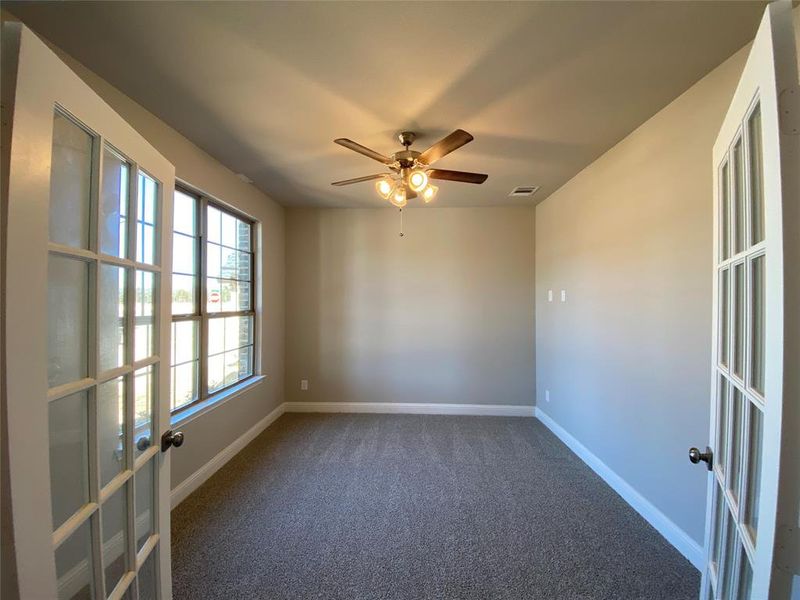 Study with French doors & ceiling fan. Study with French doors & ceiling fan.