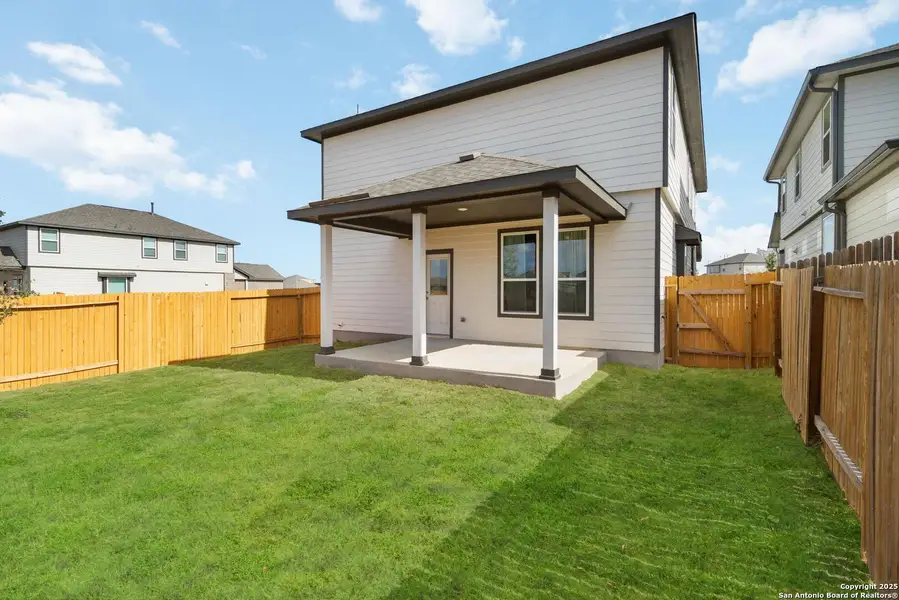 Exterior details and patio area of a home in Hickory Ridge, Elmendorf (Image 2).