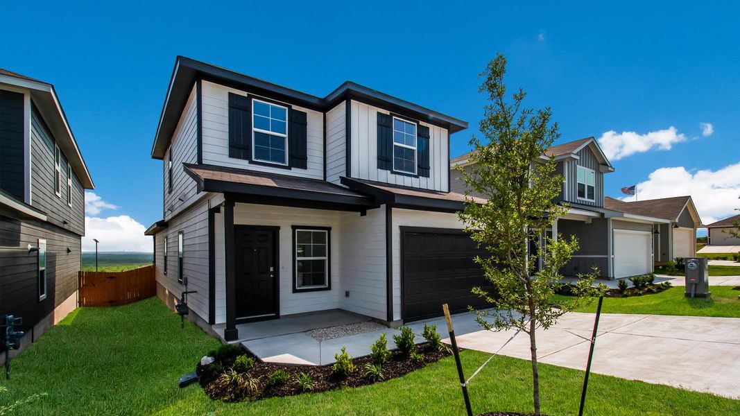 Front exterior of a new home in Wayside, Uhland, TX, highlighting curb appeal (Image 3). Front exterior of a new home in Wayside, Uhland, TX, highlighting curb appeal (Image 3).