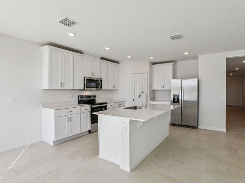 Furnished interior view inside a new home in Lake Deer Estates - Signature Series, Poinciana (Image 3).
